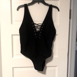 Never worn black once piece bathing suit.
